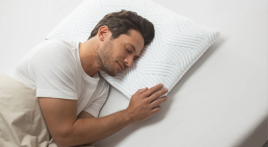 man sleeping on a pillow