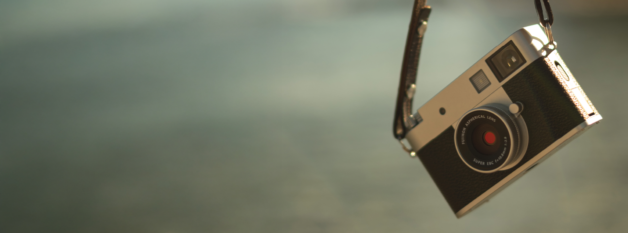 Fujifilm camera hanging on a strap