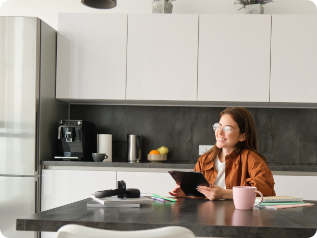 Woman at home using a tablet device